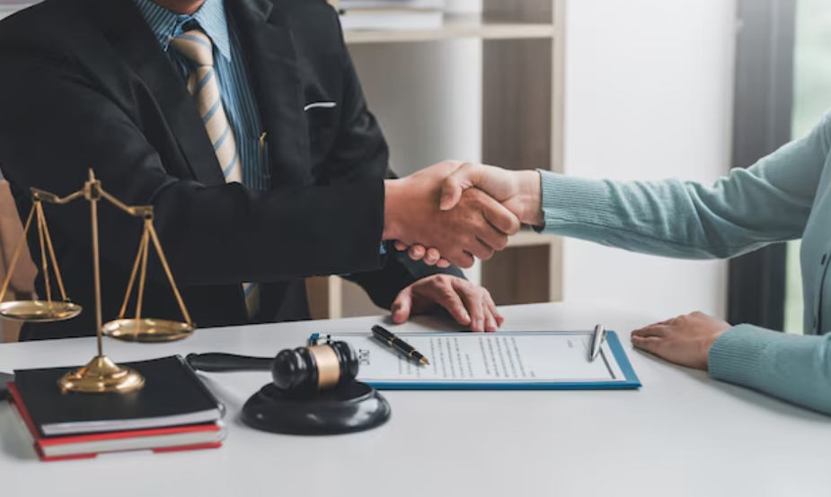 Handshake over legal documents and gavel